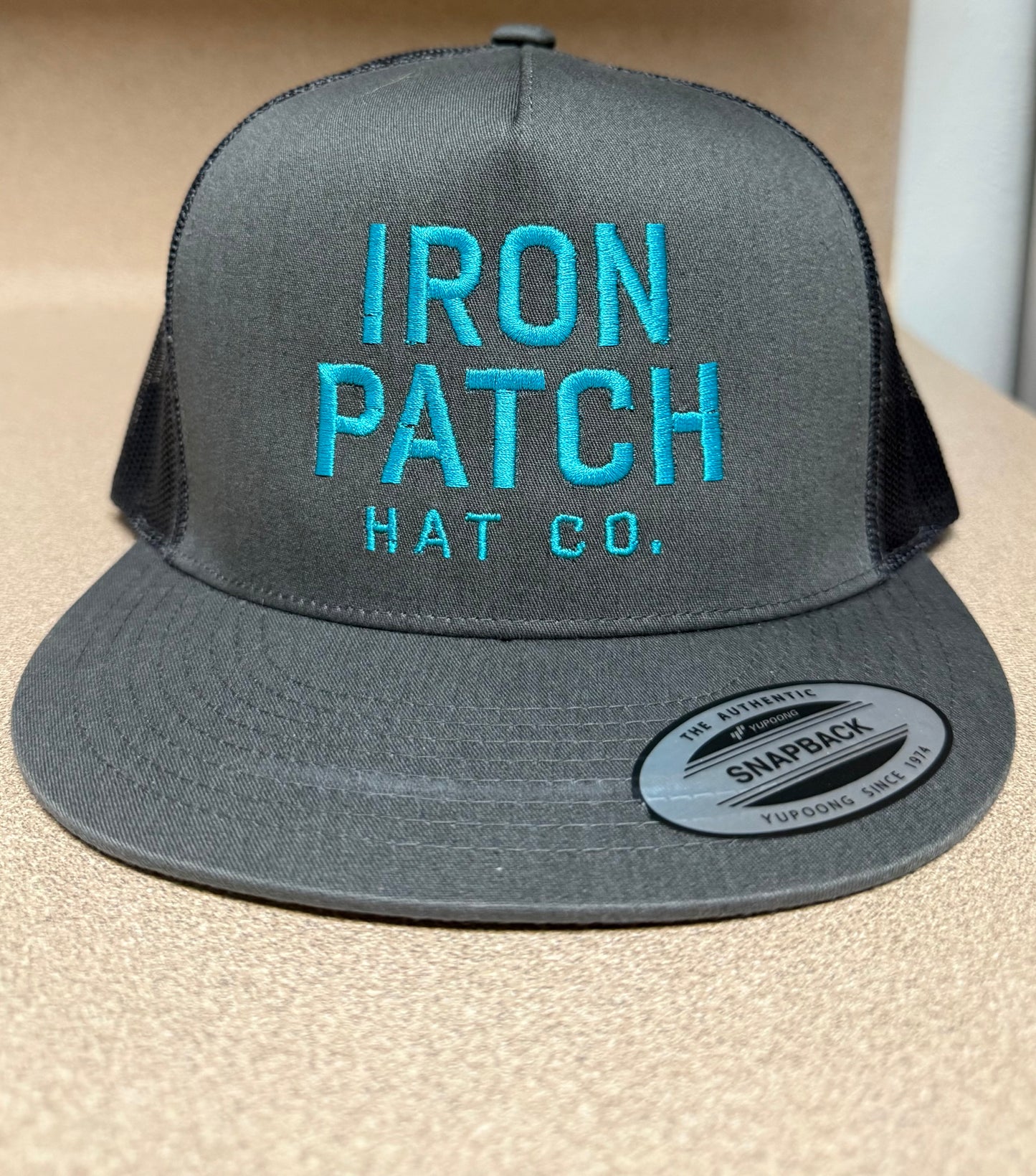 The Teal Thread Trucker – Charcoal